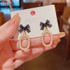 Bowknot With Hanging Pearls Earrings - Image 2