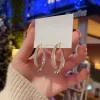 Curved S Cross Korean Earrings - Image 4