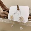 Exquisite Gold Flower Earrings - Image 4