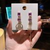 Mismatched Korean Purple Miss Universe Earrings - Image 5