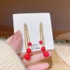 Red Hanging Balls Gold Plated Earrings - Image 2