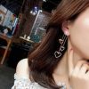 The Floating Shining Heart Mismatched Earrings - Image 3
