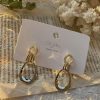 Tied Up Knotted Asymmetrical Golden Drop Earrings - Image 2