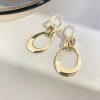 Tied Up Knotted Asymmetrical Golden Drop Earrings - Image 3