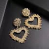 Gold Hanging Geometric Heart Earrings - Image 3